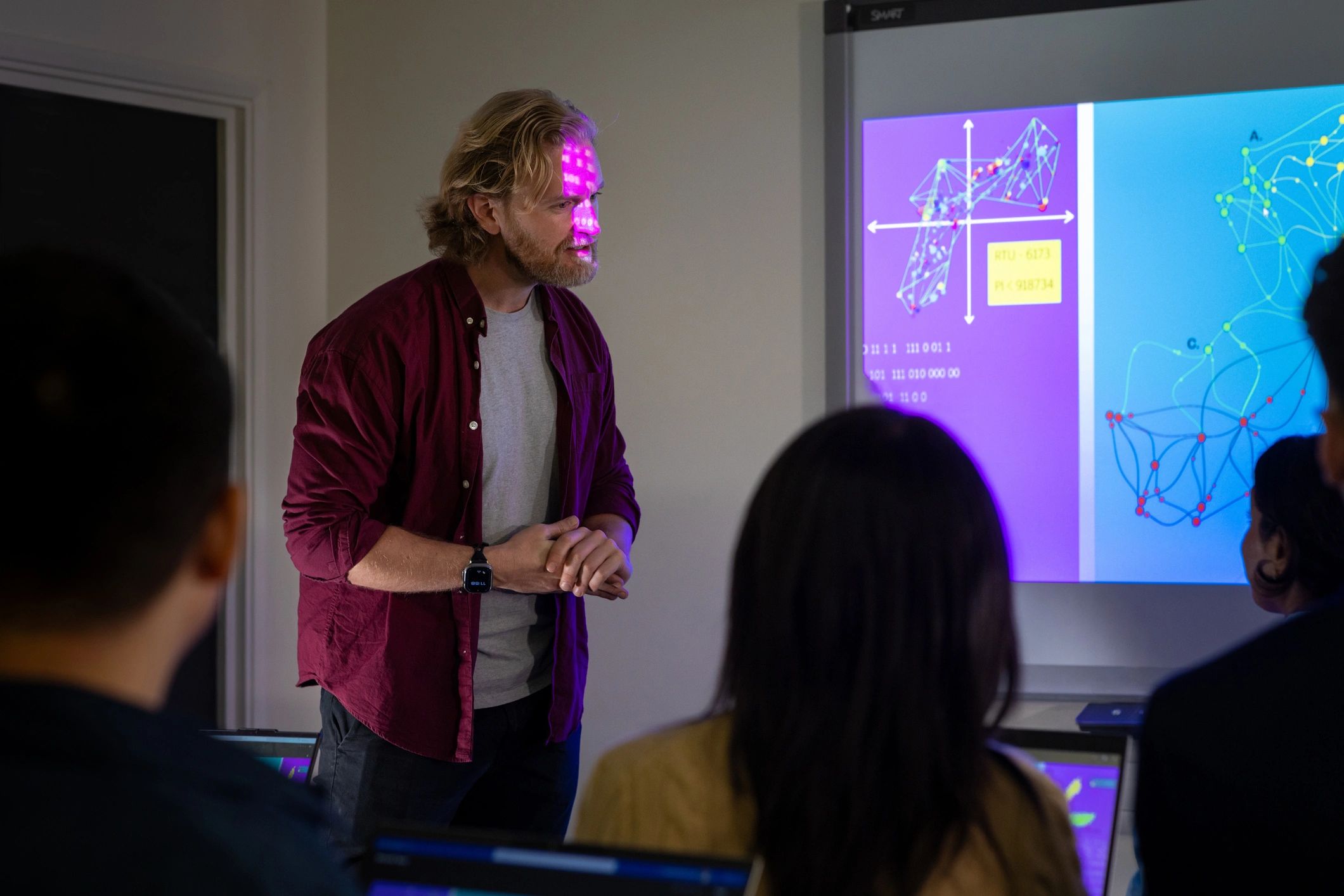 Instructor leading a training session in a classroom setting